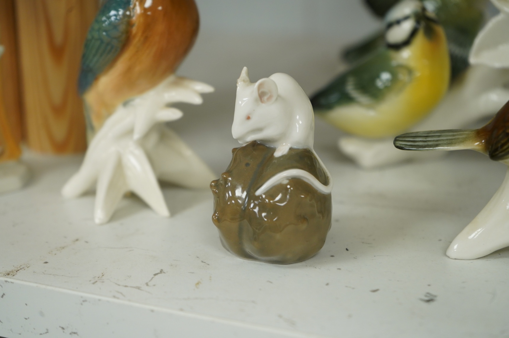 A collection of Copenhagen and other German porcelain birds, tallest 20cm